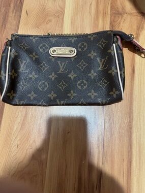 Louis Vuitton Monogram Canvas Wristlet Clutch in Brown with Gold Plaque